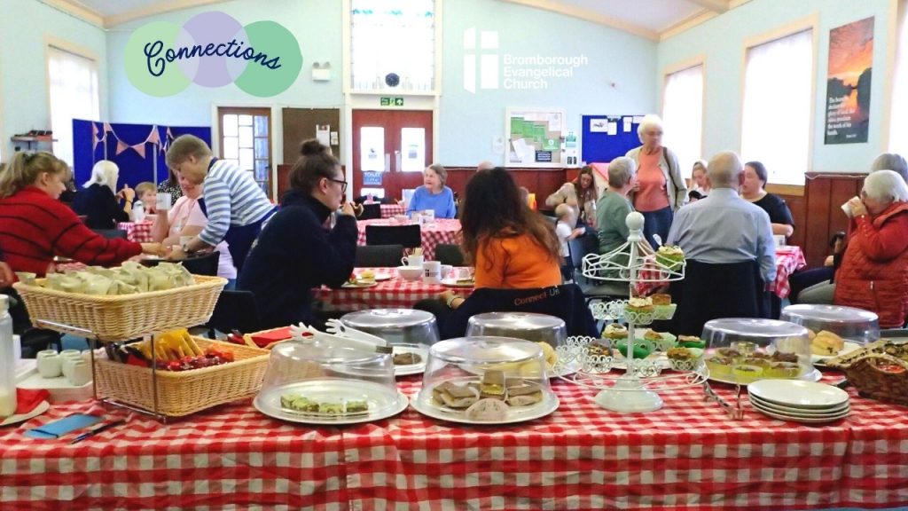 Room filled with people enjoying Macmillan coffee morning