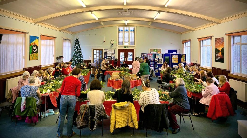 Church filled with women at a Christmas wreath-making event