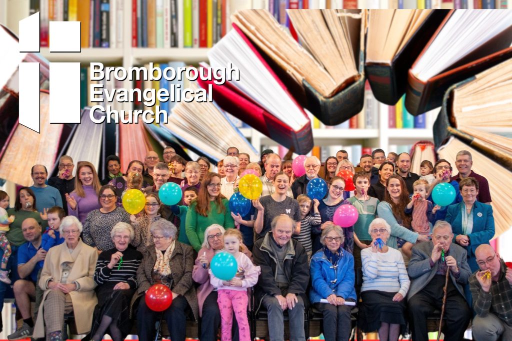 Photo showing people from the church with books in the background